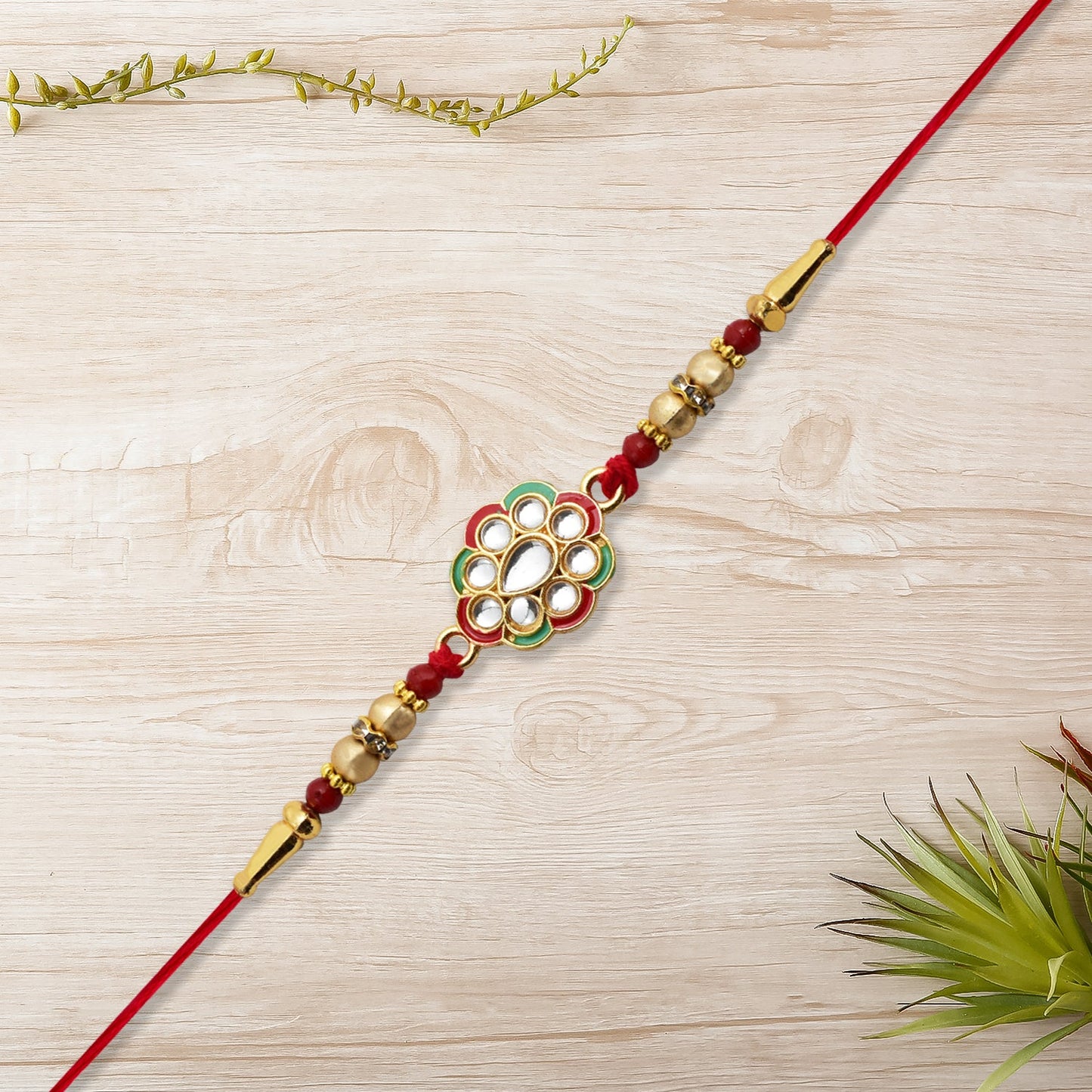 Kundan Work Floral Rakhi with Red Thread
