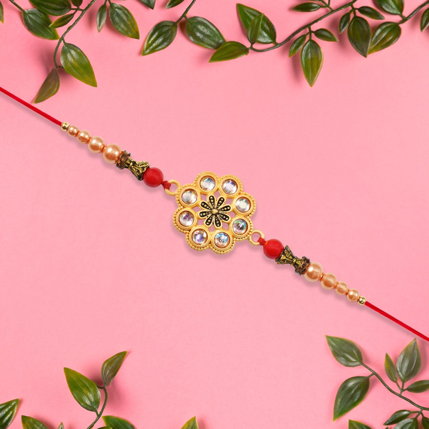 Gold-Toned Floral Rakhi with Pink Stones