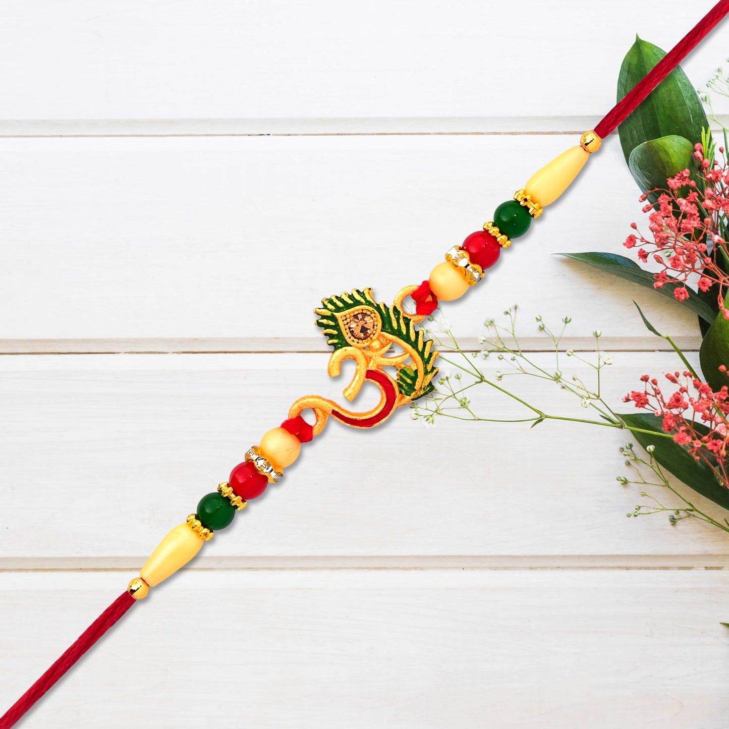 Om & Peacock feather Rakhi