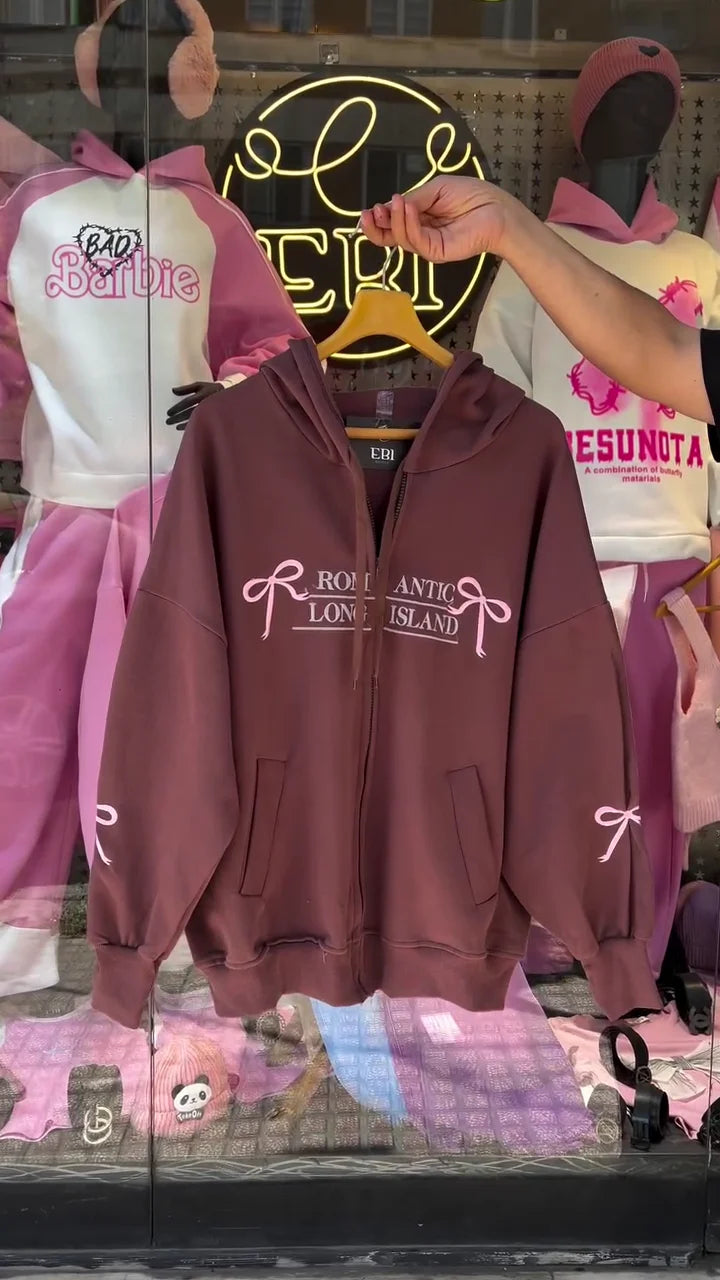 Trendy Women's Oversized Zip-Up Hoodies with 'Romantic Long Island' Print: Stylish Pink and Brown Sweatshirts Featuring Bow Graphics and Sleeve Details