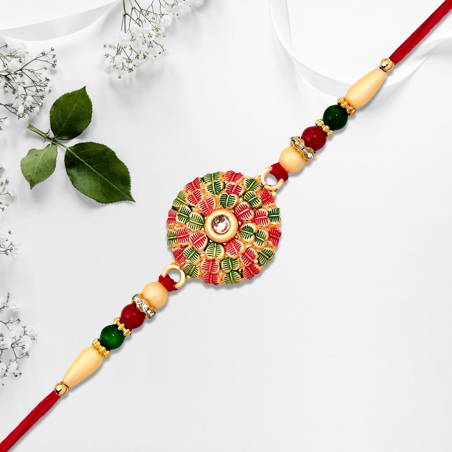 Traditional Kundan Rakhi with Golden Floral Base and Rudraksha Beads