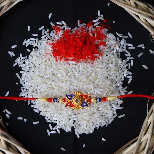 Designer Sun Motif Rakhi with Red and Blue Enamel Work