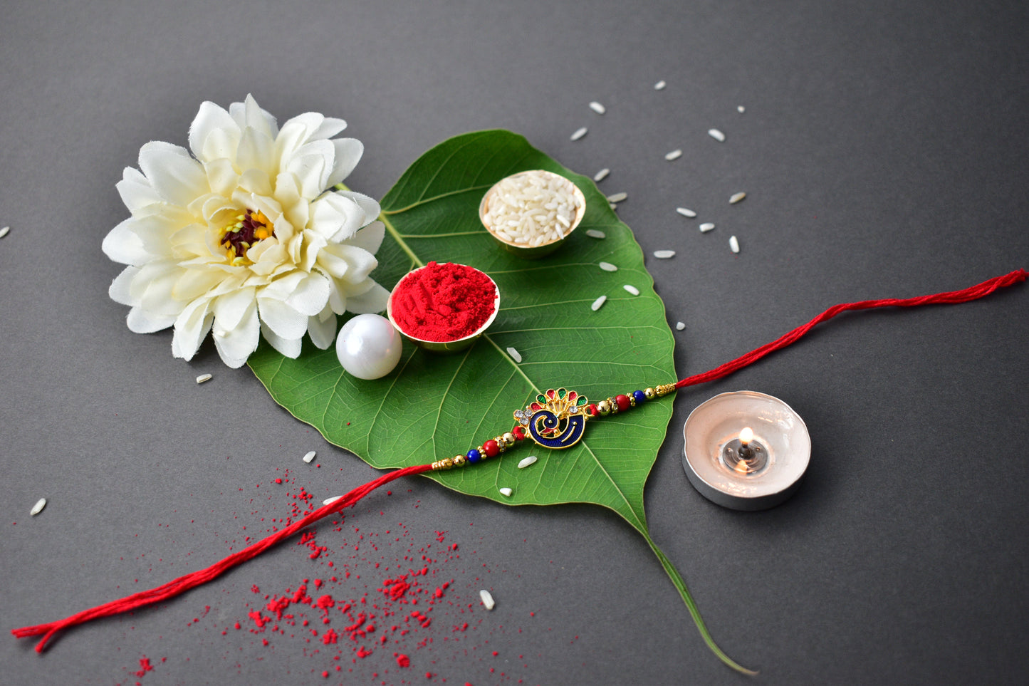 Peacock-Themed Designer Rakhi with Colorful Beads – Blue, Red & Gold Finish