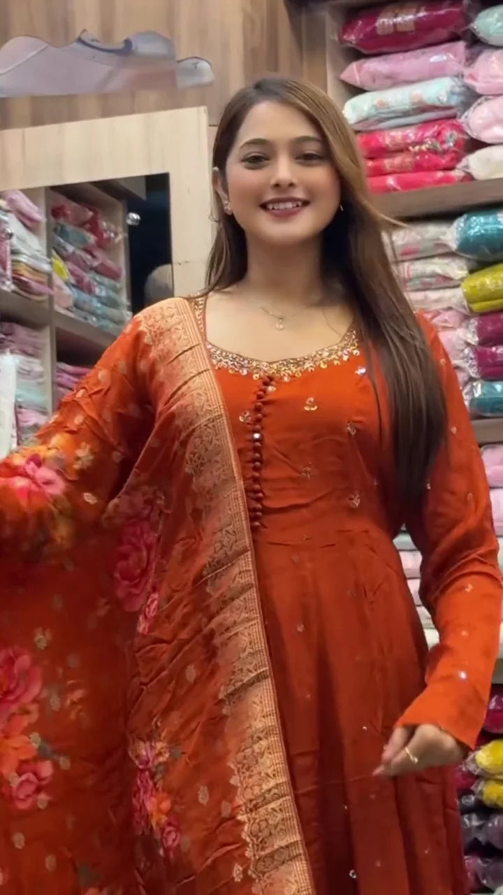 Burnt Orange Anarkali Gown with Intricate Neckline Embroidery and Floral Banarasi Dupatta, an Orange Tie-Dye Straight Kurta Set with White Threadwork