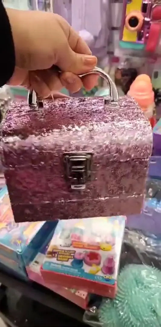 Glittery Pink Makeup Trunk: Multi-Tiered Cosmetic Set with Heart-Shaped Glosses, Pink Nail Polish, and Flower-Shaped Blushes