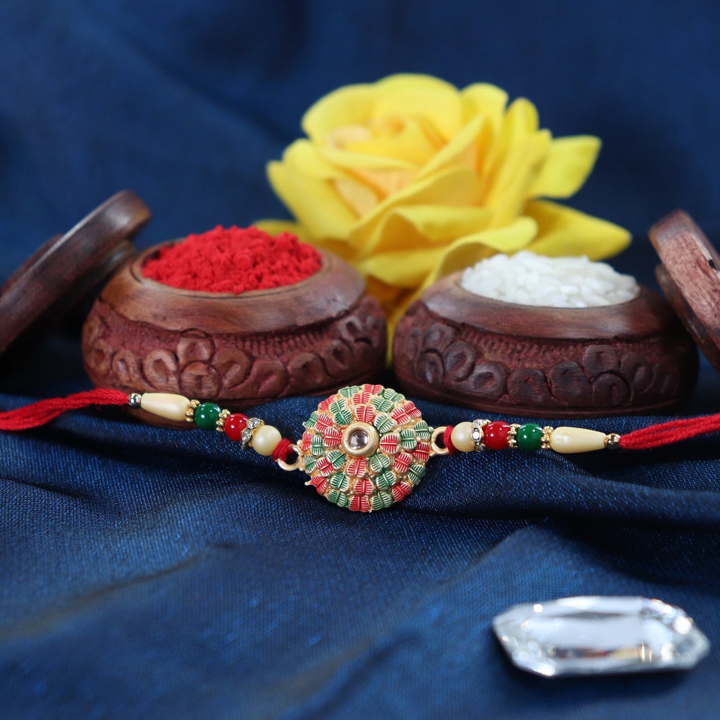 Traditional Kundan Rakhi with Golden Floral Base and Rudraksha Beads