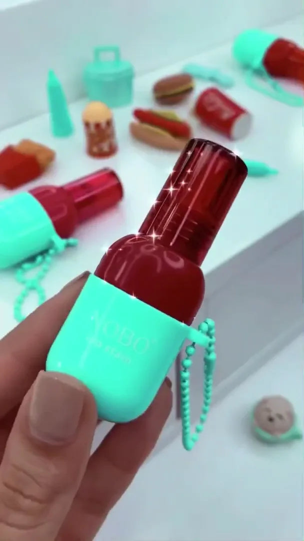 Capsule Lip Stain Keychain: Cherry Red Liquid Lip Color in a Unique Mint Green Pill-Shaped Travel Applicator