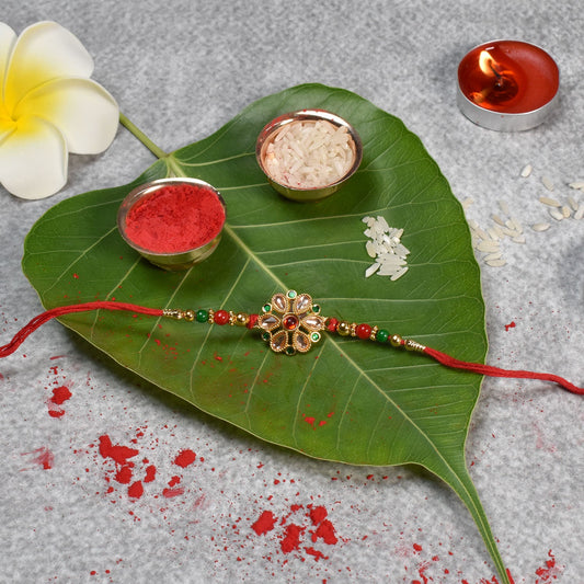 Floral Kundan Rakhi with Red-Green Beads and Golden Finish