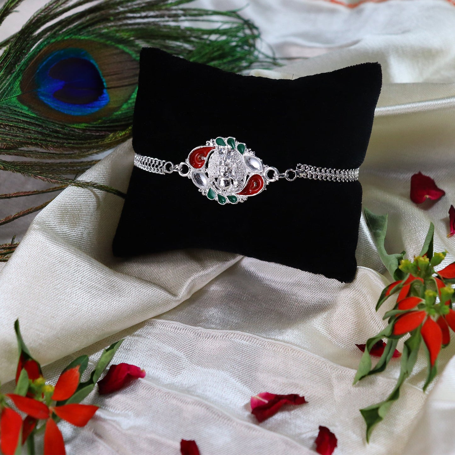 Designer Rakhi with Ornamental Floral Motif and Silver Finish Chain