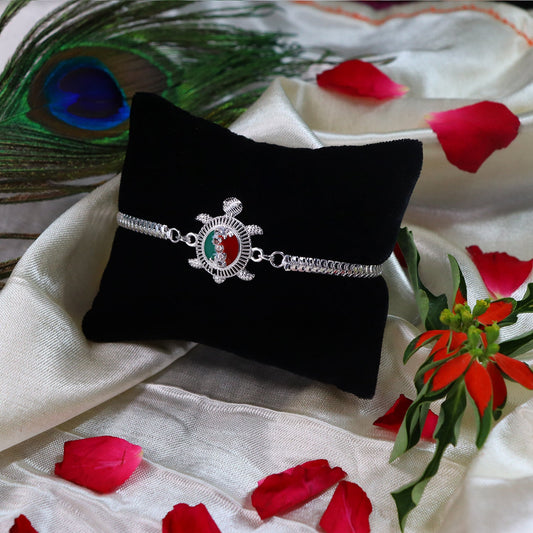 Turtle Motif Rakhi with Red-Green Enamel and Silver Metal Chain