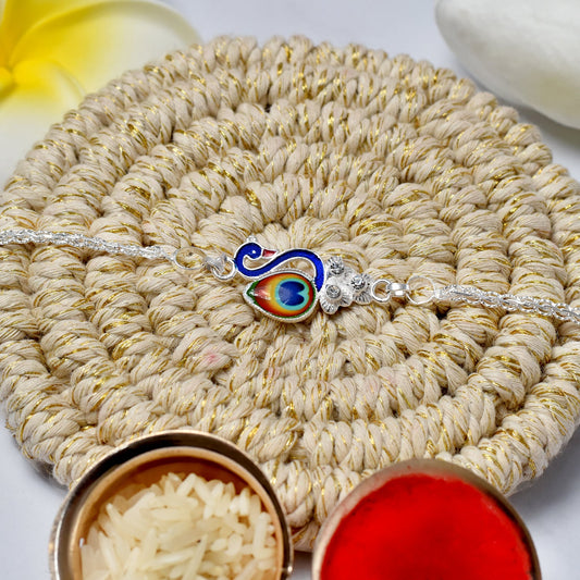 Elegant Silver Peacock Rakhi with Tricolor Enamel – Designer Rakhi for Brother