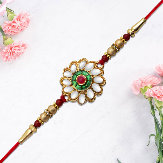 Kundan Floral Rakhi with Green & Red Centerpiece