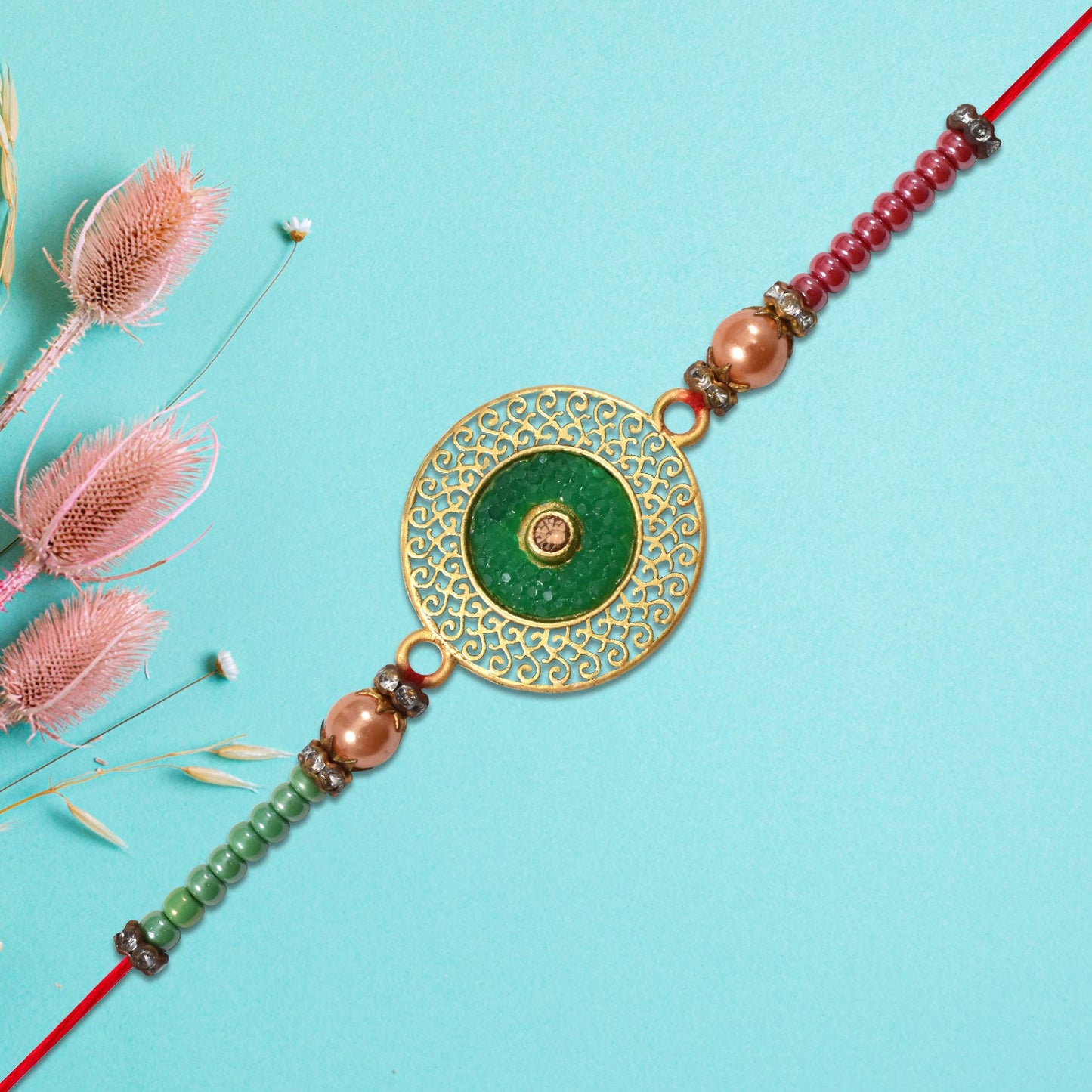 Elegant Green Circular Rakhi with Golden Filigree Design
