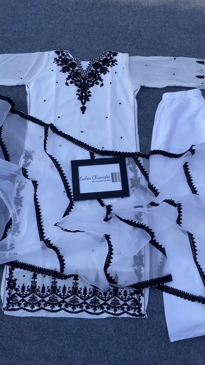 Elegant Black & White Embroidered Kurta Set – Women’s Traditional Ethnic Wear · White Shirt with Intricate Black Floral Embroidery