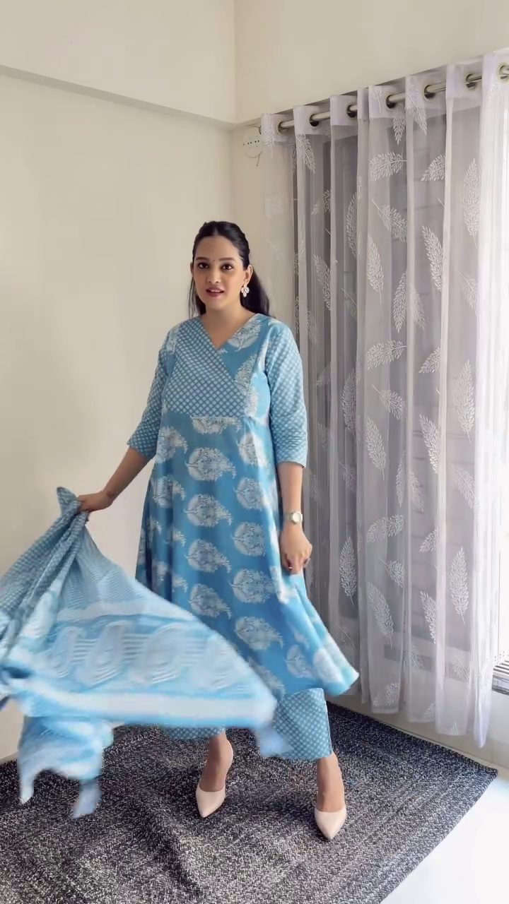 A beautiful blue ethnic outfit with traditional prints, featuring a kurta with a matching dupatta and comfortable pants, perfect for casual or semi-formal occasions.