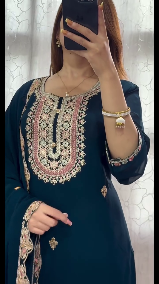 traditional outfit with intricate embroidery, giving off a royal and elegant vibe. The design's rich colors and detailed work are perfect for festive or formal occasions