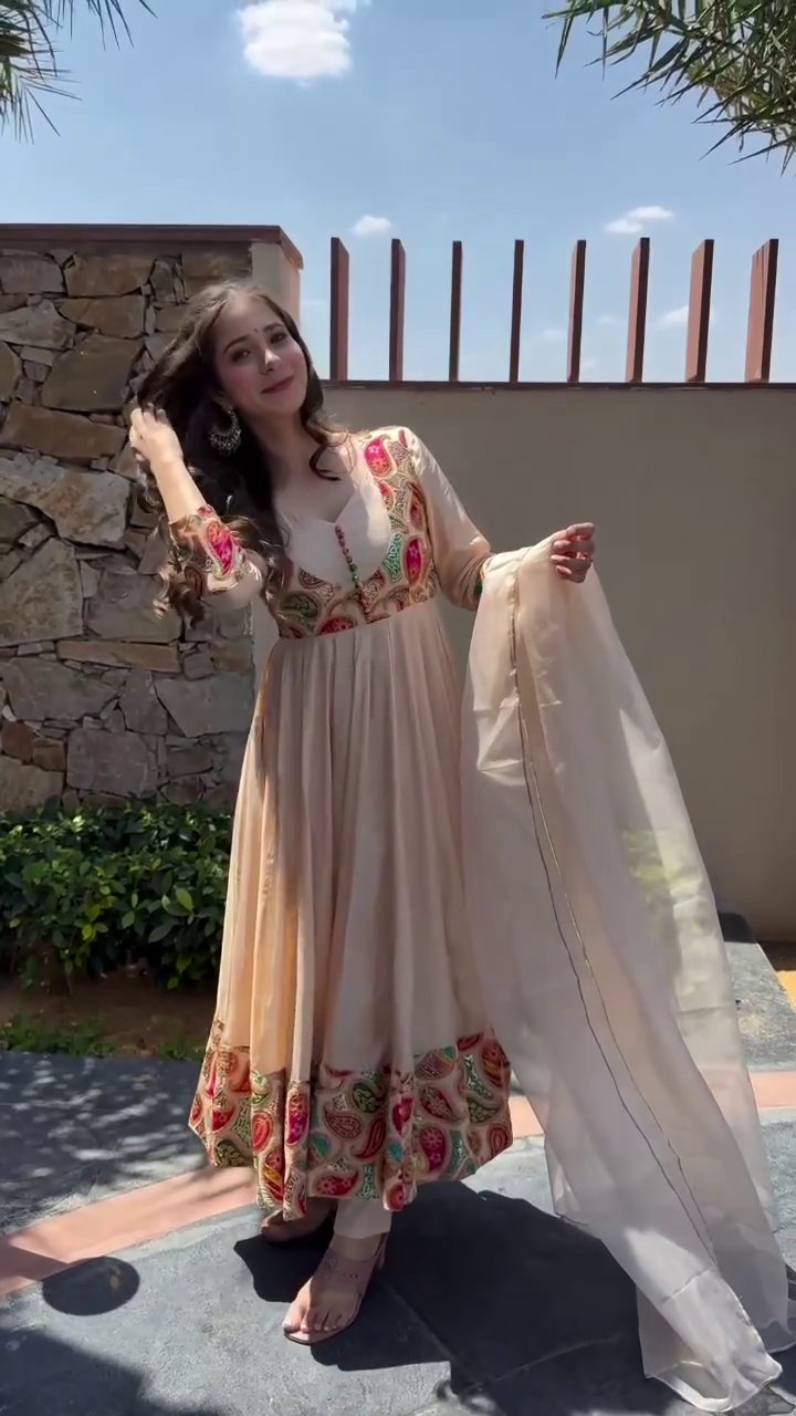 Elegant Beige Anarkali Dress with Colorful Embroidered Hem and Flowing Dupatta – Perfect for Traditional Festive Occasions