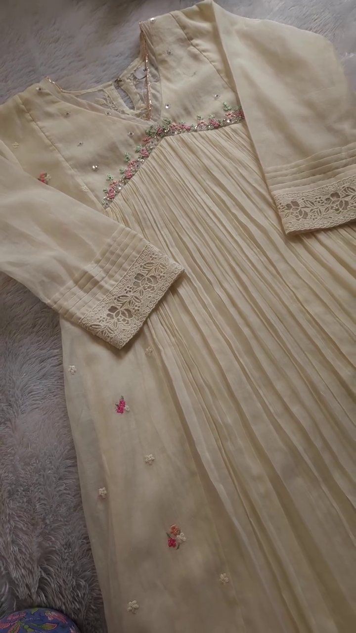 Cream Georgette Anarkali Kurta with Delicate Floral Embroidery, Sequins Detailing, Pleated Flair, and Lace Trimmed Sleeves – Graceful Ethnic Wear Ideal for Festive Gatherings, Day Functions, and Traditional Celebrations