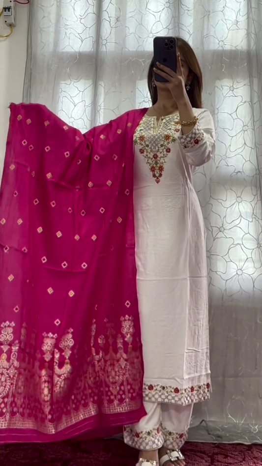 Elegantly Draped in a Traditional White Embroidered Kurta with a Vibrant Magenta Dupatta, Showcasing Intricate Floral and Geometric Designs for a Stylish Ethnic Look