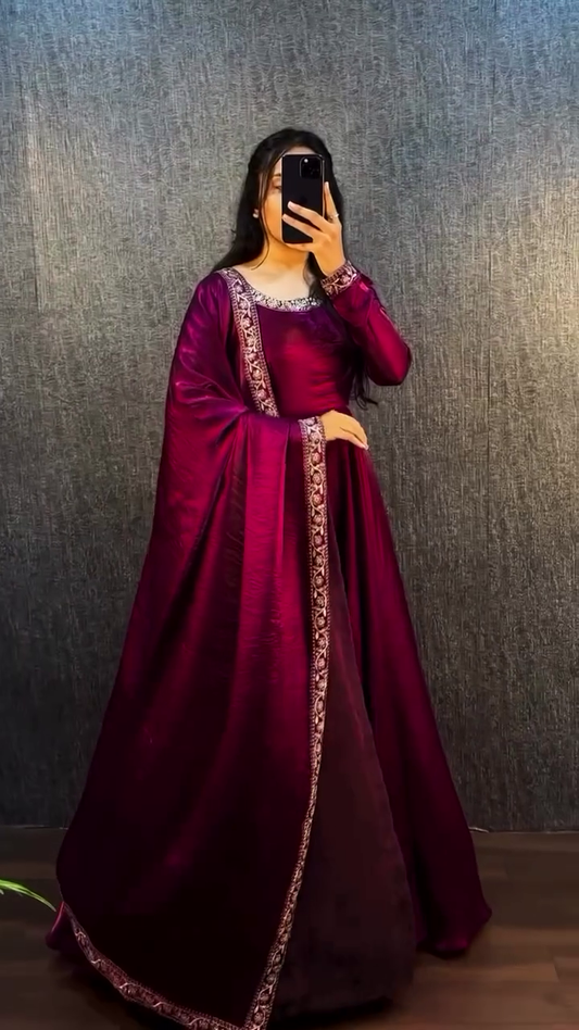 Elegant Maroon Satin Floor-Length A-line Dress with Intricate Embroidered Borders, Long Sleeves, and Traditional Ethnic Design