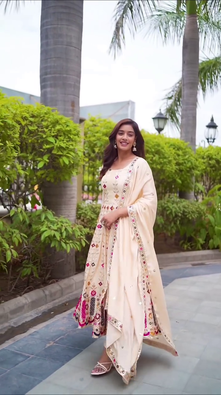 Elegant Cream Anarkali Dress with Colorful Floral Embroidery and Sequin Detailing, Perfect for Weddings, Festivals, or Special Occasions