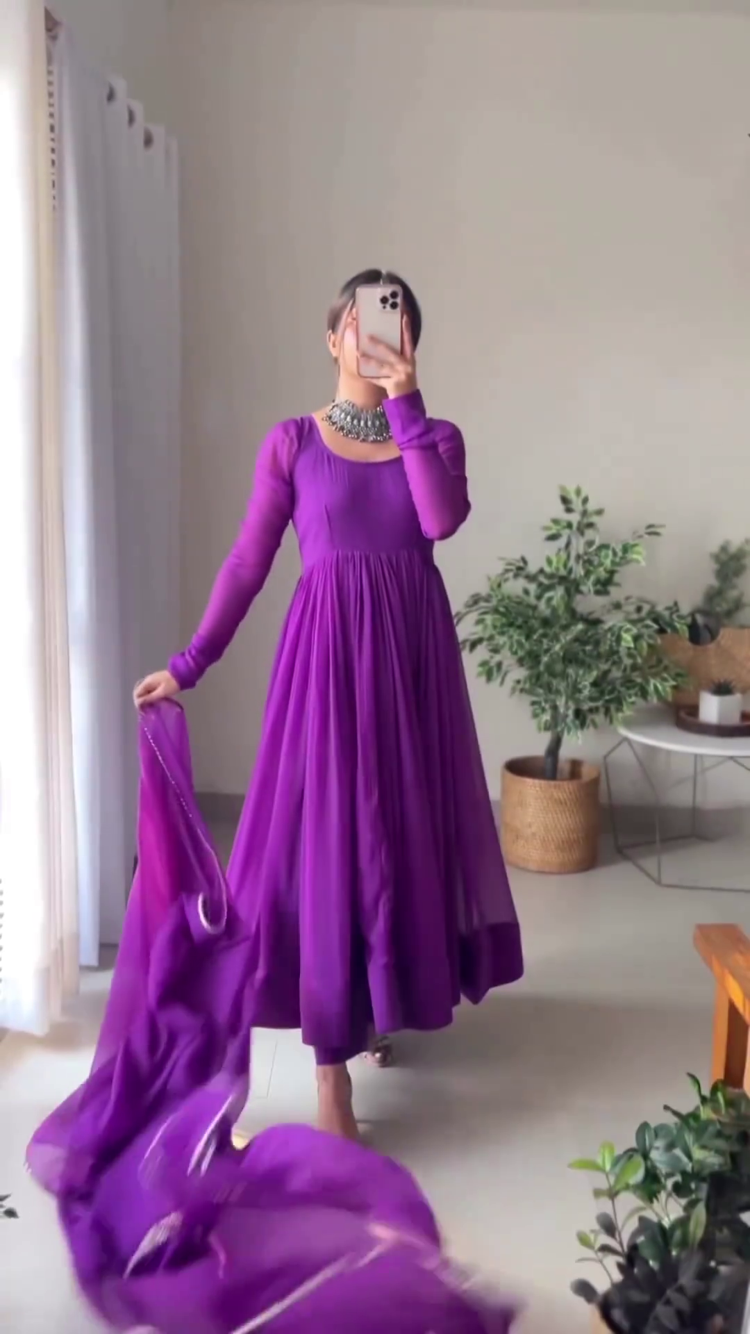 Elegant Purple Anarkali Dress with Pleated Detailing and Sheer Dupatta, Accentuated by a Statement Silver Necklace, Ideal for Traditional Occasions and Festive Celebrations