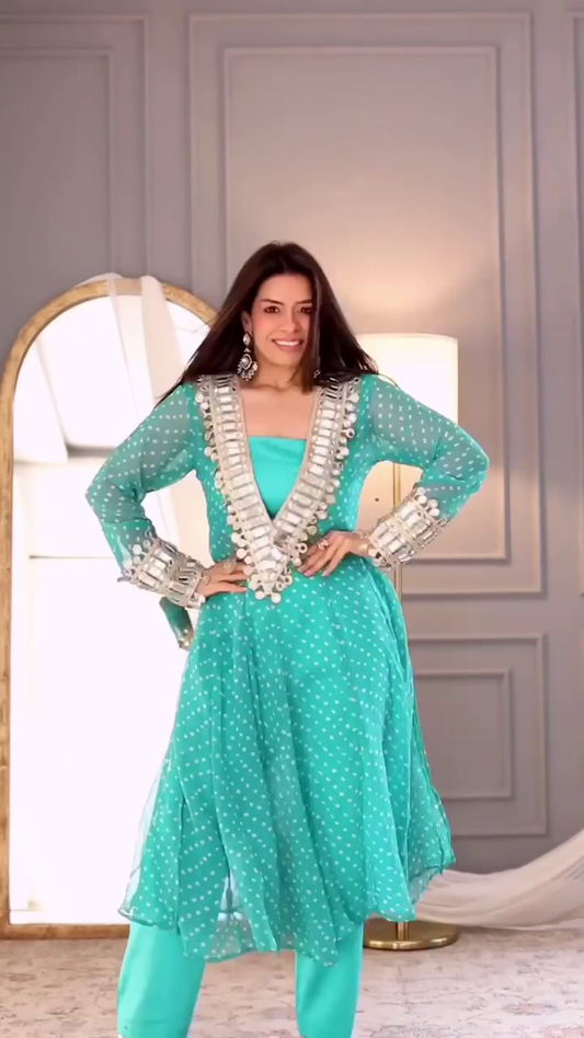 Turquoise Polka Dot Anarkali Dress with Silver Embellished Detailing on the Neckline and Sleeves, Paired with a Matching Churidar for a Modern Traditional Look