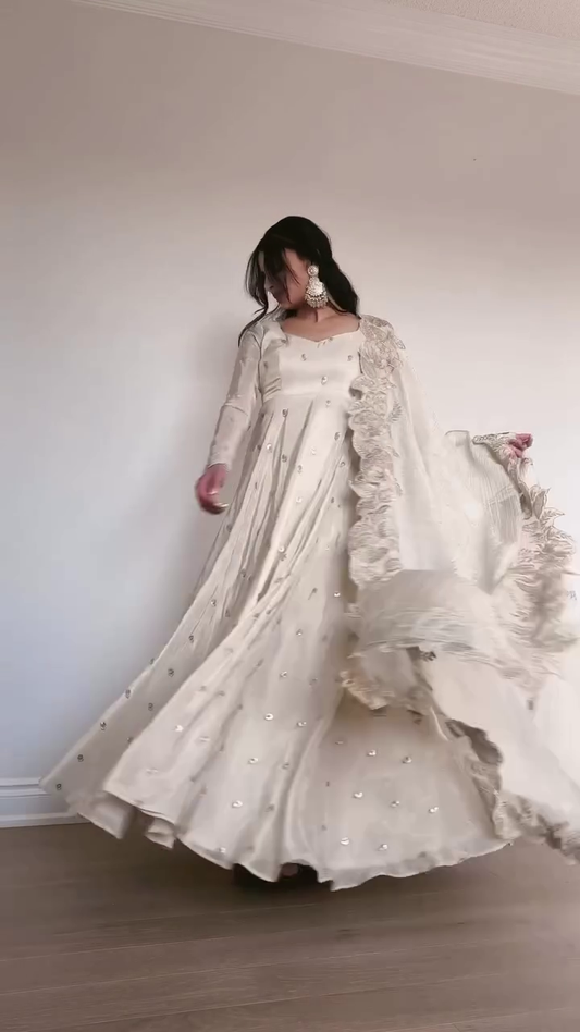 Graceful Ivory Anarkali Gown with Sequin Embellishments, Flowing Chiffon Dupatta with Lace Details, and Elegant Long Sleeves for Festive Occasions