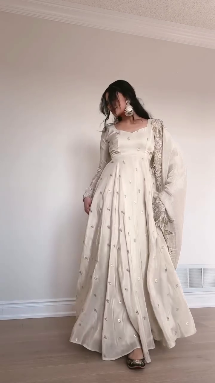 Graceful Ivory Anarkali Gown with Sequin Embellishments, Flowing Chiffon Dupatta with Lace Details, and Elegant Long Sleeves for Festive Occasions