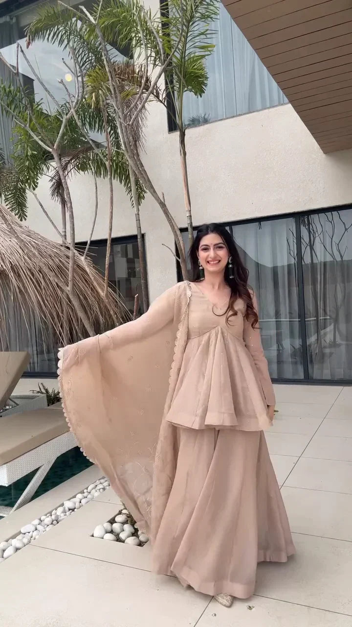 Beige Peplum Style Anarkali Dress with Flared Pants – Featuring Intricate Embroidery and a Sheer Dupatta with Scalloped Edges, Perfect for Weddings