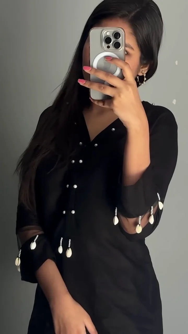 Black Tunic with Button Detailing and Embellished Sleeves, Paired with Matching Black Palazzo Pants featuring Intricate White Embroidery