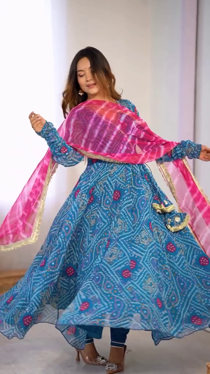 Blue Bandhani Printed Anarkali Set with Full Sleeves, Tassel Detailing, and Contrasting Pink Tie-Dye Dupatta with Golden Border – A Perfect Traditional Ensemble for Festive and Cultural Occasions