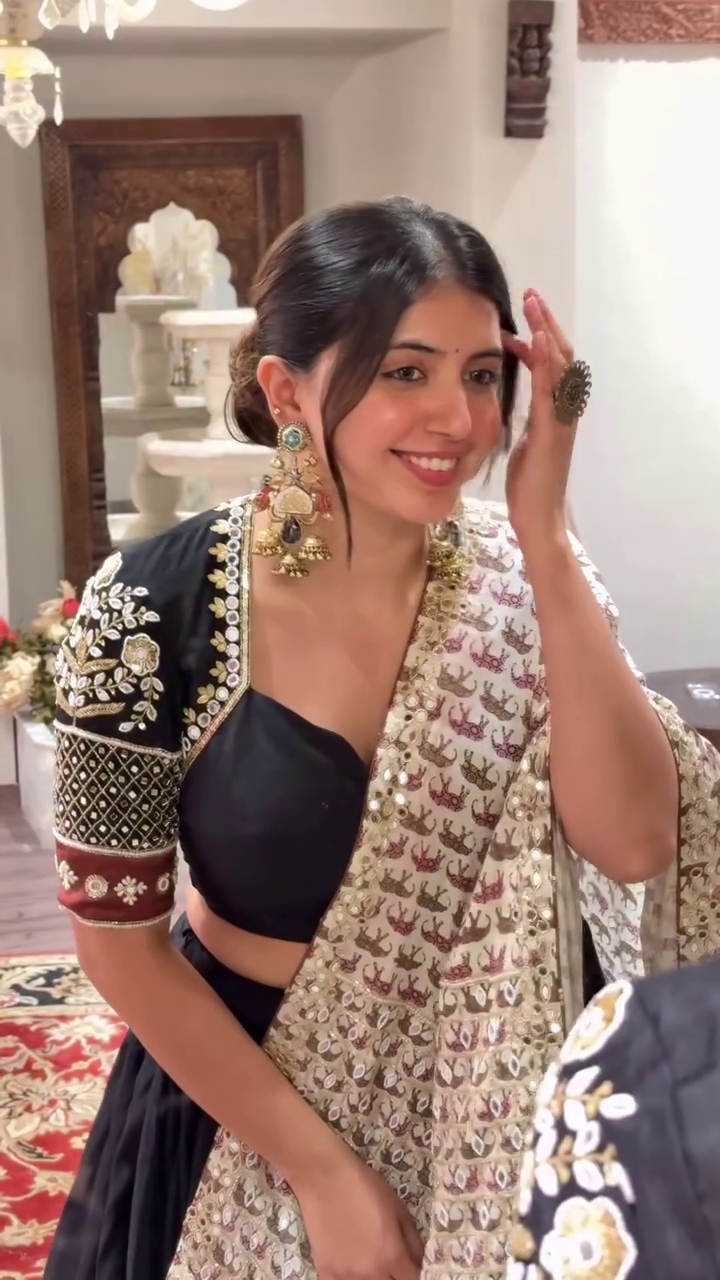 Black Lehenga Set Plain Flared Skirt, Intricately Embroidered Half-Sleeve Blouse with Mirror Work, and Heavy Threadwork Dupatta with Golden Tassel – Ethnic Look for Weddings, Navratri, and Festive Occasions