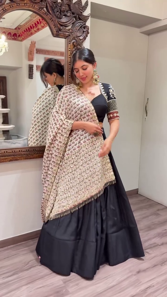 Black Lehenga Set Plain Flared Skirt, Intricately Embroidered Half-Sleeve Blouse with Mirror Work, and Heavy Threadwork Dupatta with Golden Tassel – Ethnic Look for Weddings, Navratri, and Festive Occasions