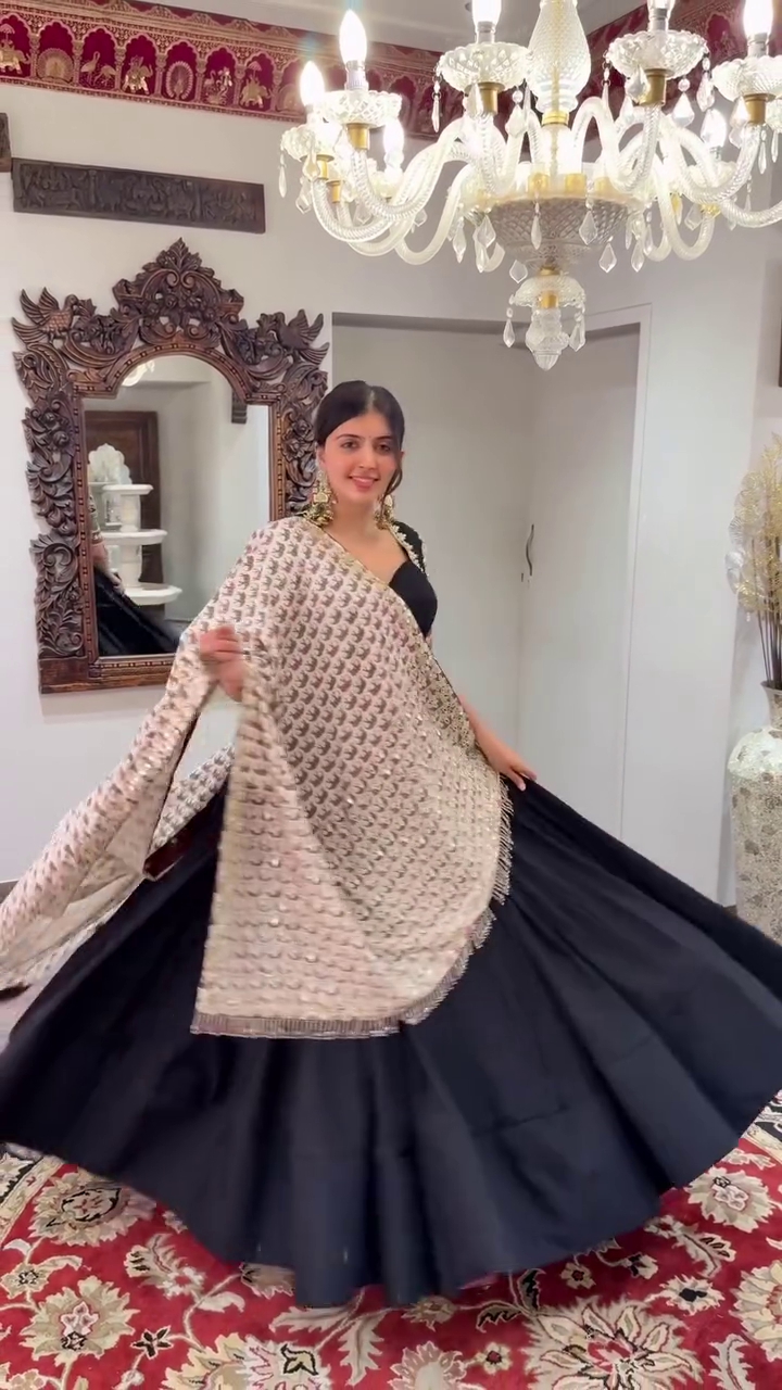 Black Lehenga Set Plain Flared Skirt, Intricately Embroidered Half-Sleeve Blouse with Mirror Work, and Heavy Threadwork Dupatta with Golden Tassel – Ethnic Look for Weddings, Navratri, and Festive Occasions