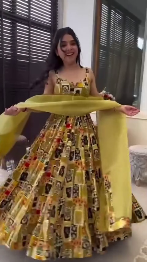 Vibrant Yellow Printed Anarkali Dress with Bold Artwork, Paired with a Contrasting Yellow Dupatta – Perfect for a Festive Look or Special Celebration