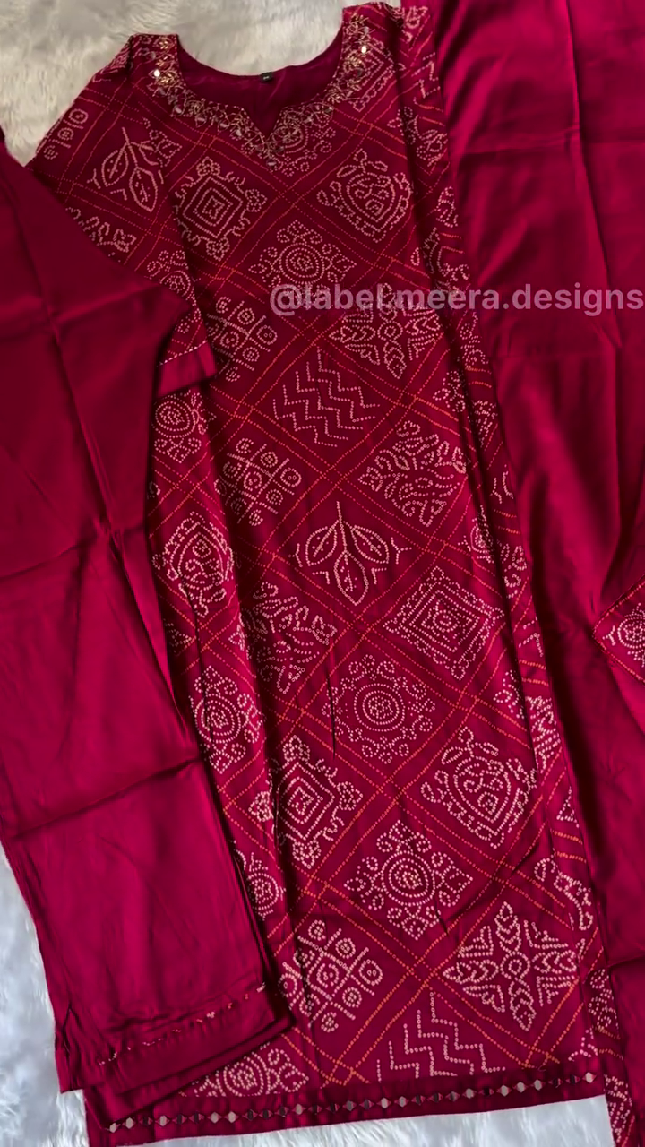 Maroon Printed Suit with Intricate Traditional Motifs, Embellished Neckline, and Matching Bottom for Festive and Casual Wea